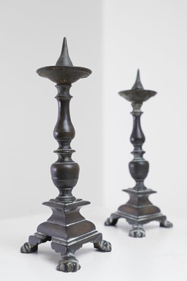 Lot 348 - A pair of bronze pricket candlesticks