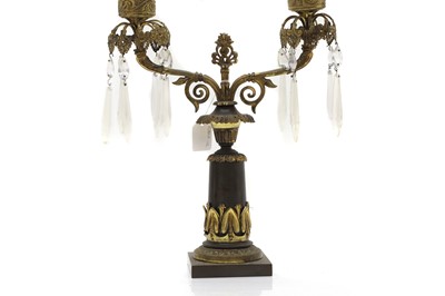 Lot 151 - A bronze two branch candalabra