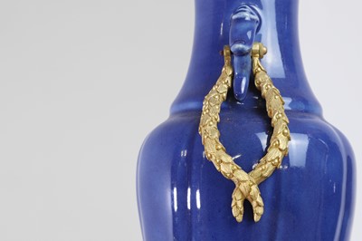 Lot 311 - A pair of ormolu-mounted blue-glazed porcelain vases