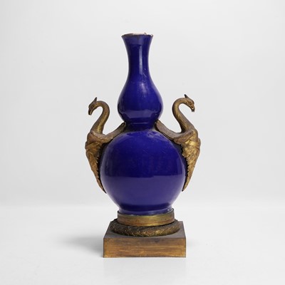 Lot 75 - A Chinese blue-glazed double gourd vase