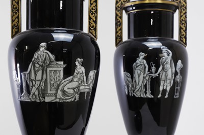Lot 346 - A pair of black-glazed pottery neoclassical urn vases
