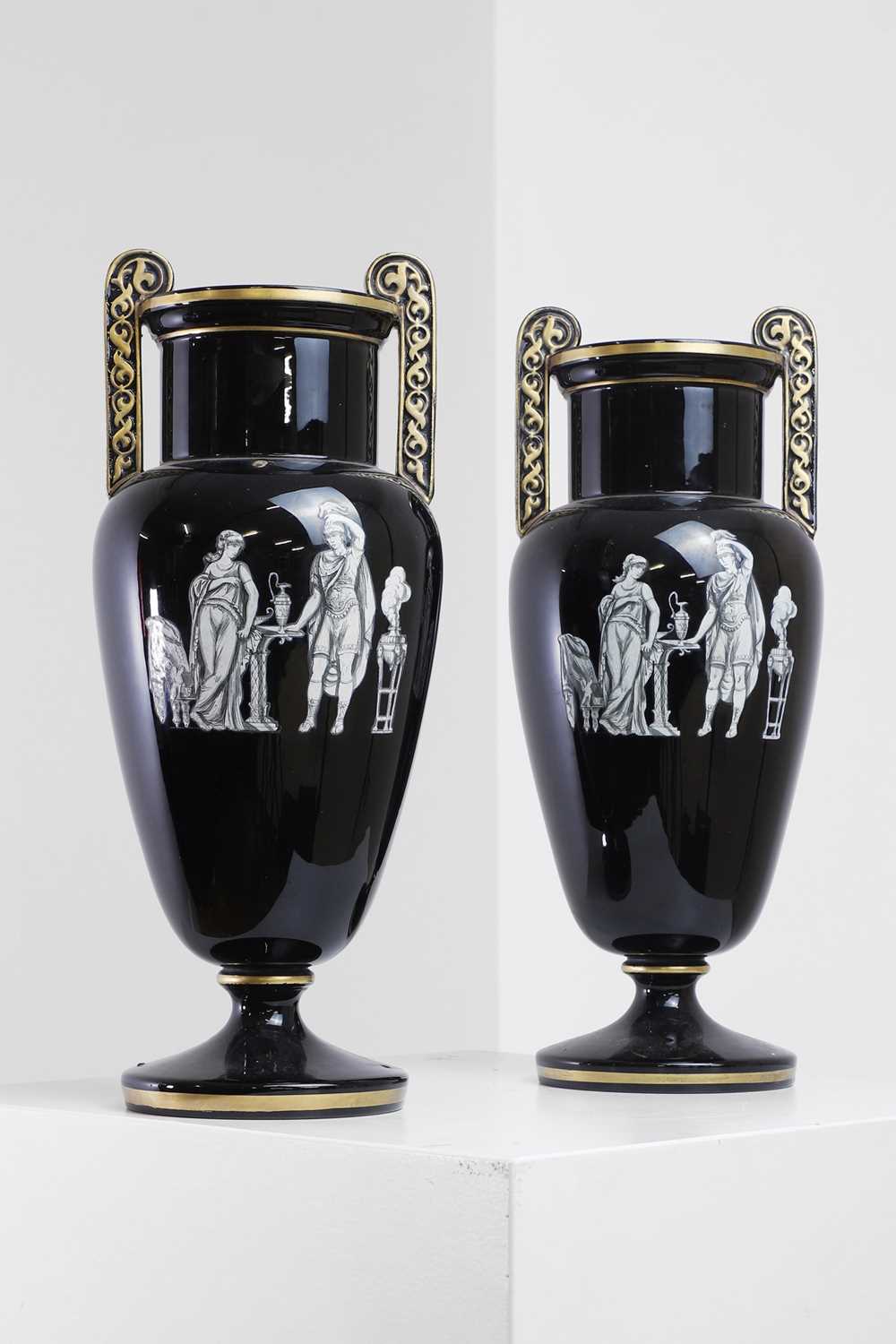 Lot 346 - A pair of black-glazed pottery neoclassical urn vases