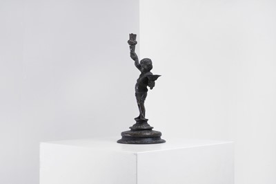 Lot 423 - A bronze figural candleholder