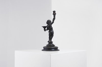 Lot 423 - A bronze figural candleholder