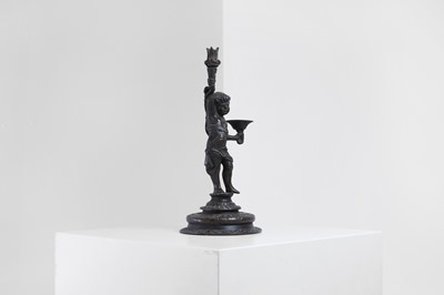 Lot 423 - A bronze figural candleholder