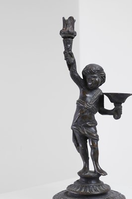 Lot 423 - A bronze figural candleholder