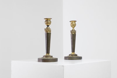 Lot 398 - A pair of neoclassical gilt-bronze candlesticks