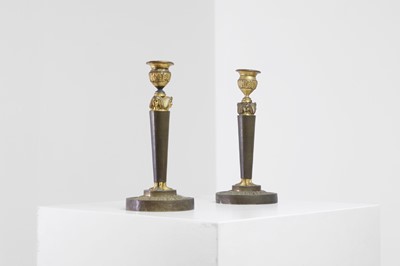 Lot 398 - A pair of neoclassical gilt-bronze candlesticks