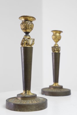 Lot 398 - A pair of neoclassical gilt-bronze candlesticks