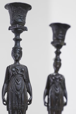 Lot 345 - A pair of neoclassical bronze and marble candlesticks