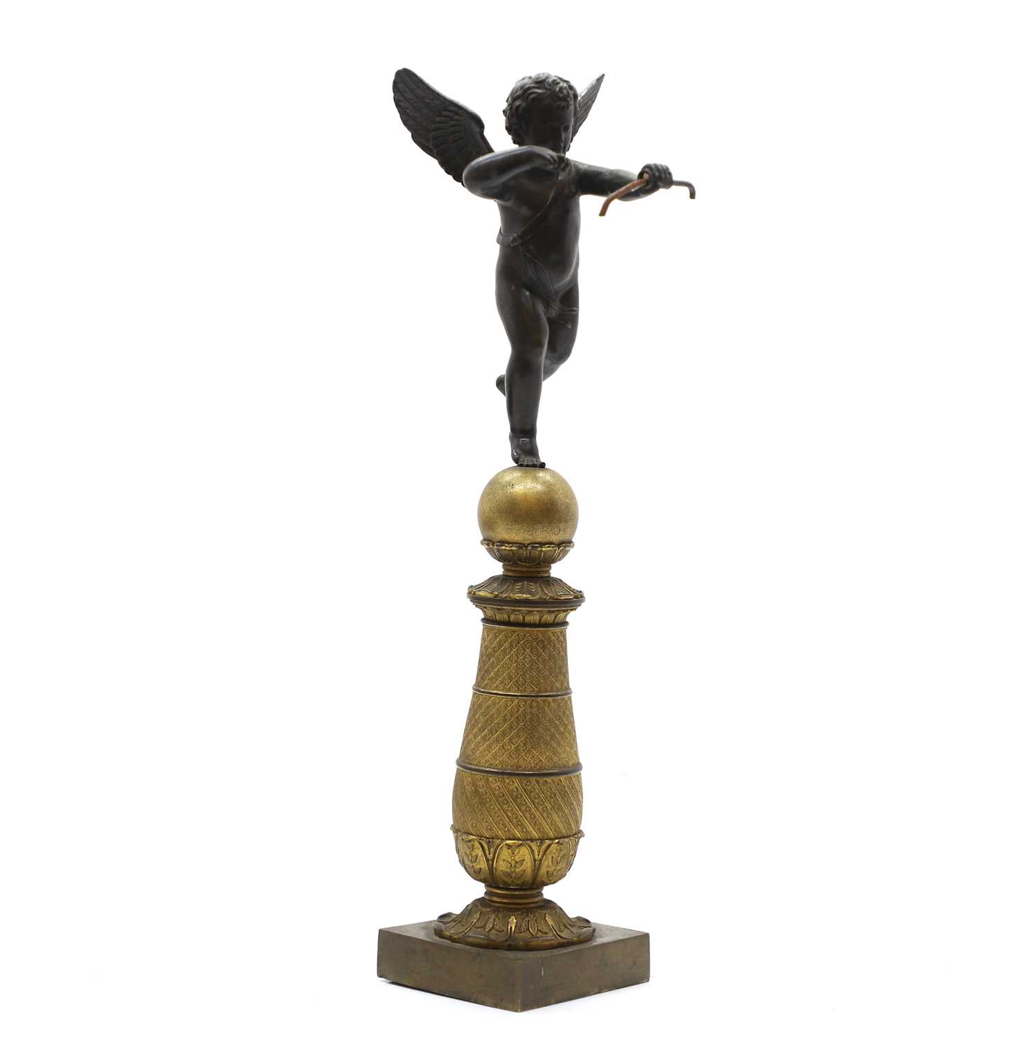Lot 93 - A bronze and gilt bronze figure of Cupid