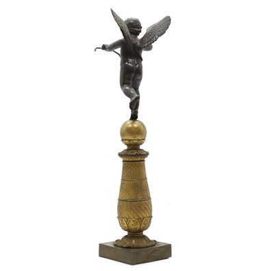 Lot 93 - A bronze and gilt bronze figure of Cupid