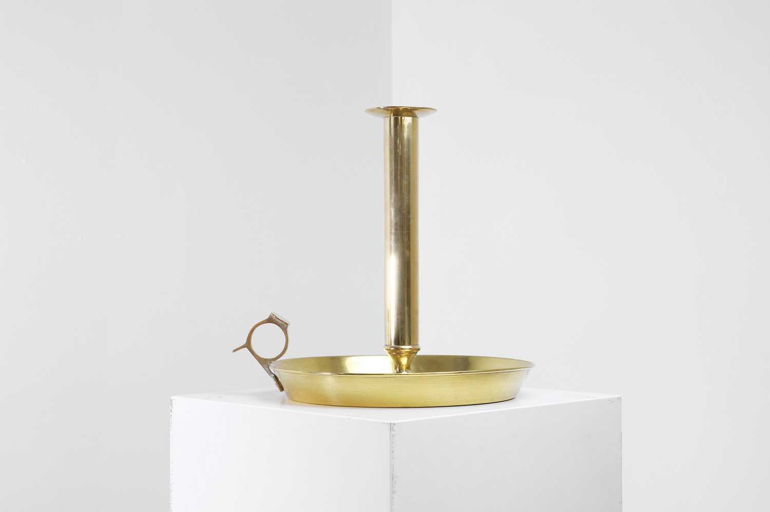 Lot 336 - A large brass chamberstick