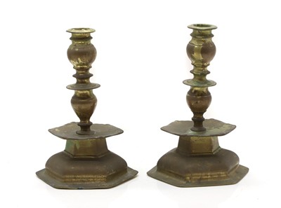 Lot 133 - A pair of hexagonal bronze candlesticks