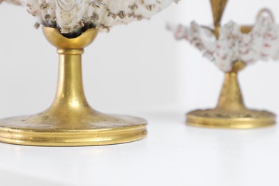 Lot 303 - Two Victorian shell and gilt-metal mounted chambersticks