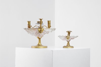 Lot 303 - Two Victorian shell and gilt-metal mounted chambersticks