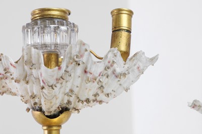 Lot 303 - Two Victorian shell and gilt-metal mounted chambersticks
