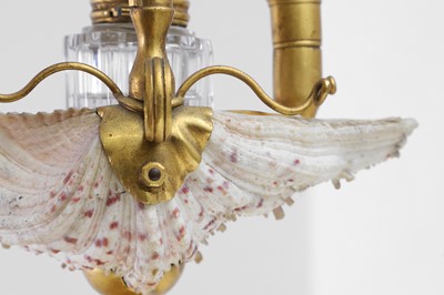 Lot 303 - Two Victorian shell and gilt-metal mounted chambersticks