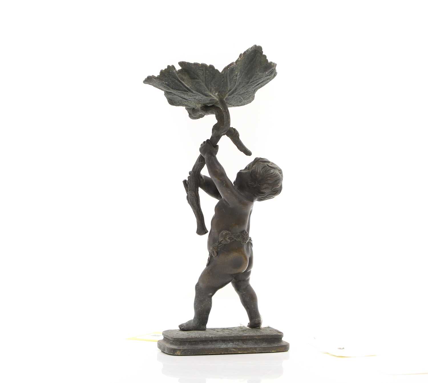 Lot 95 - A bronze putto