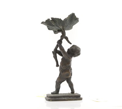 Lot 95 - A bronze putto
