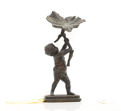 Lot 95 - A bronze putto