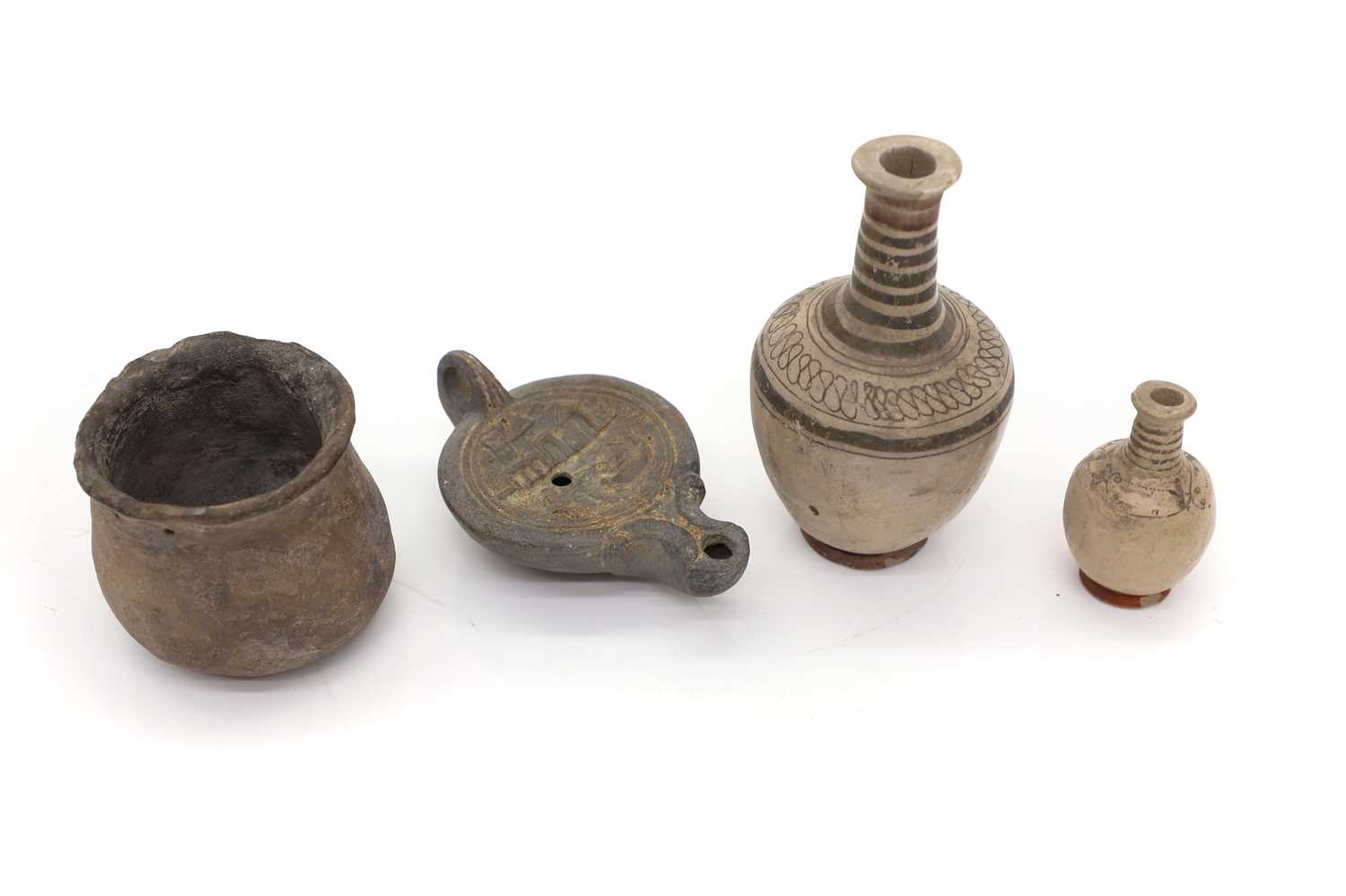 Lot 117 - A roman terracotta oil lamp