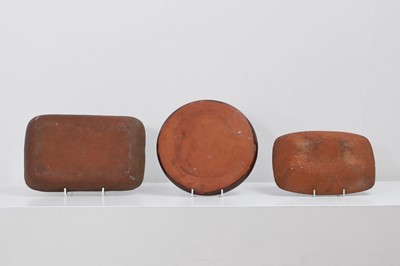 Lot 321 - Three terracotta slipware dishes
