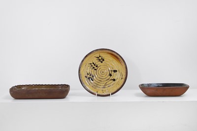Lot 321 - Three terracotta slipware dishes