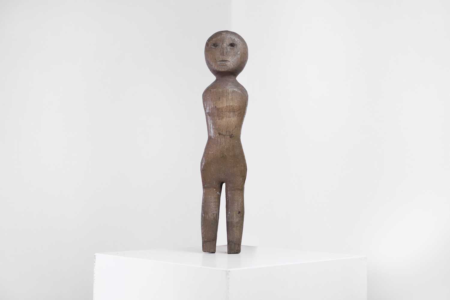 Lot 404 - A carved oak doll