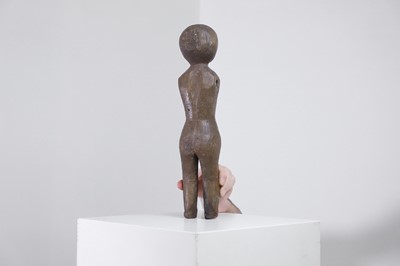 Lot 404 - A carved oak doll