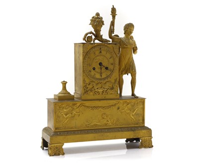 Lot 85 - A gilt-metal mantel clock