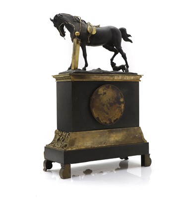 Lot 83 - A gilt and patinated bronze mantel clock