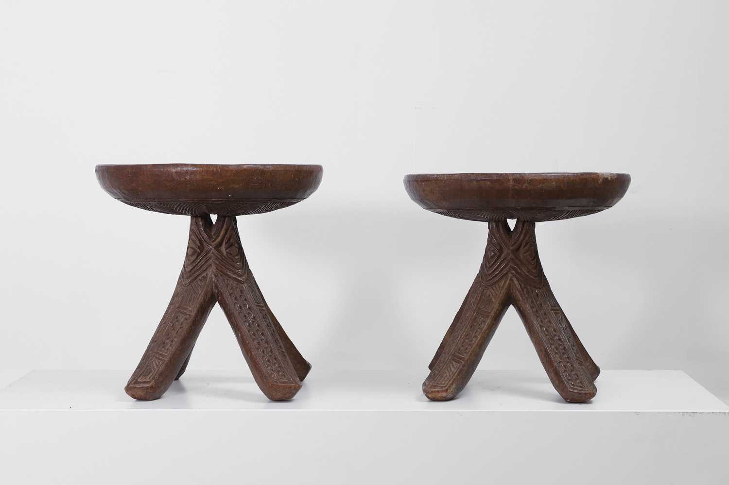 Lot 412 - A pair of carved Igbo stools