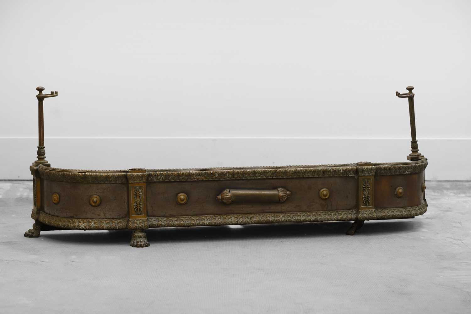Lot 159 - A steel and brass fire kerb