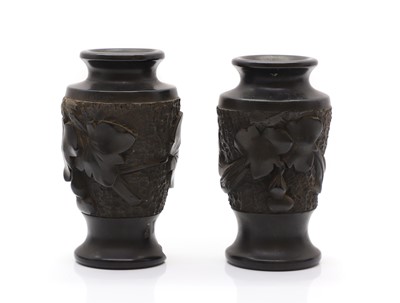 Lot 114 - A pair of carved hardwood vases