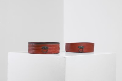 Lot 401 - A pair of Regency red-lacquered coasters