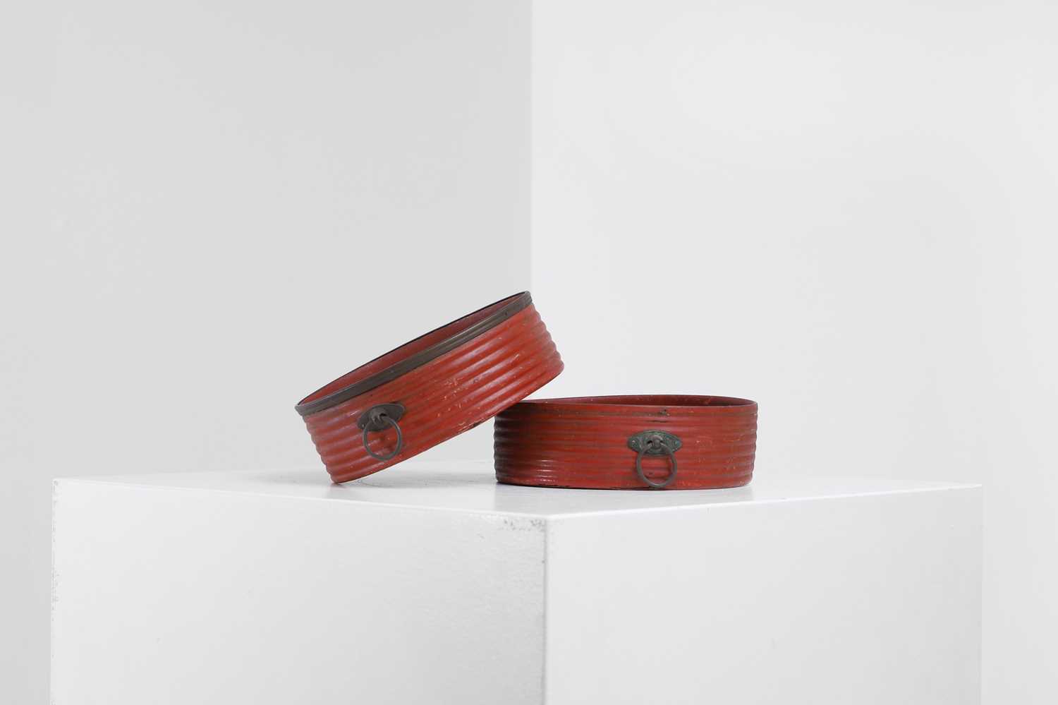 Lot 401 - A pair of Regency red-lacquered coasters