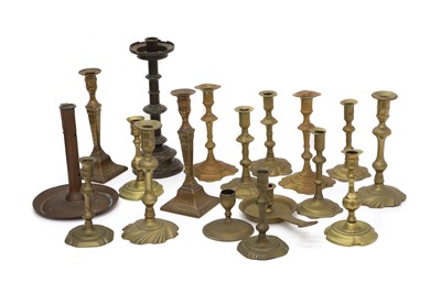 Lot 164 - A large group of brass candlesticks
