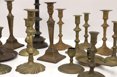 Lot 164 - A large group of brass candlesticks