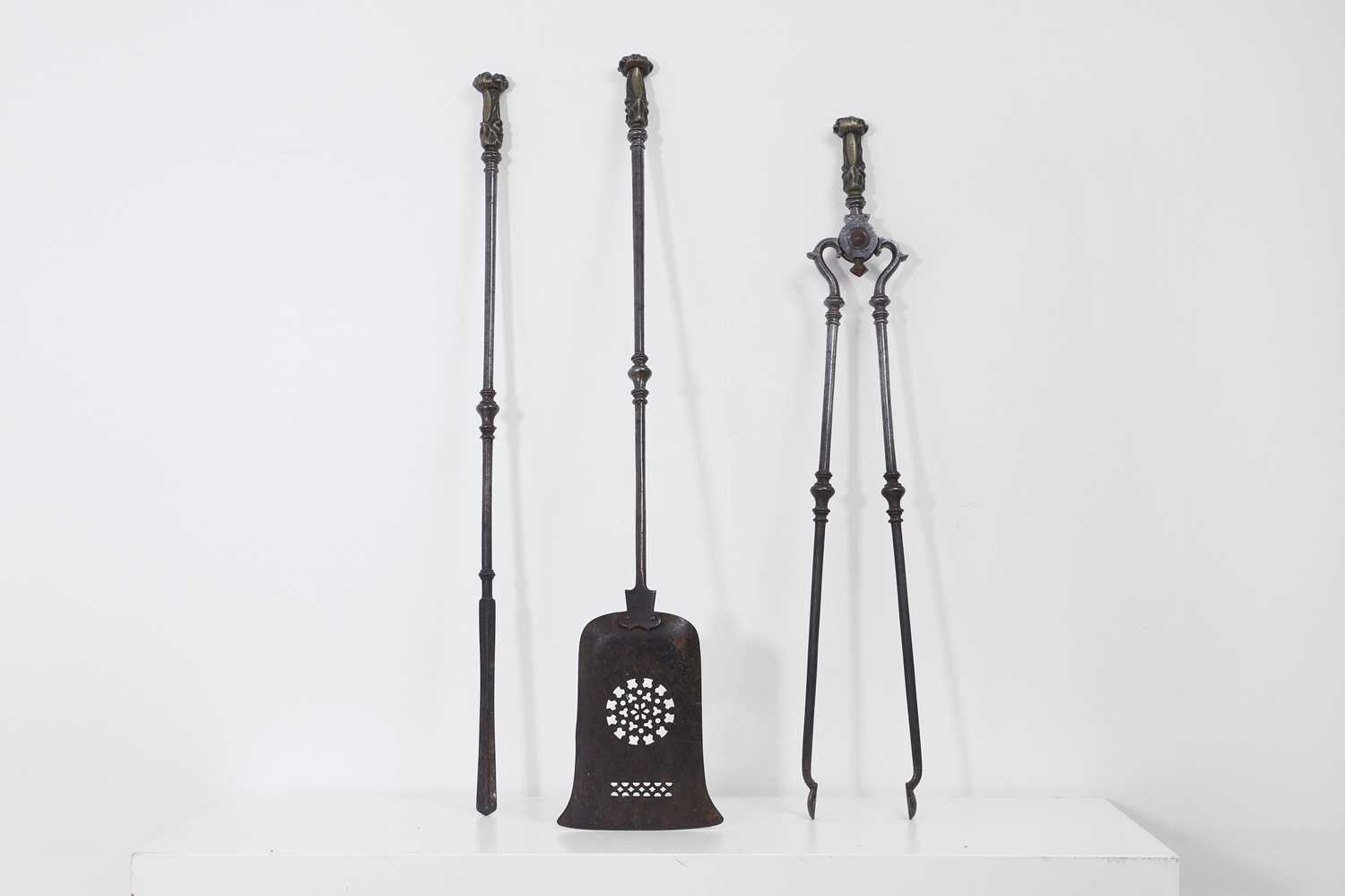 Lot 382 - A set of George III steel and brass fire tools