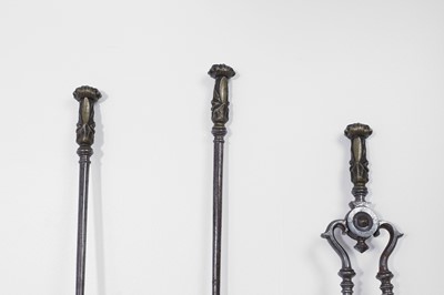 Lot 382 - A set of George III steel and brass fire tools