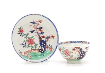 Lot 57 - A Lowestoft style cup and saucer