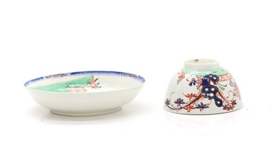 Lot 57 - A Lowestoft style cup and saucer