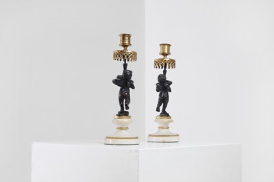 Lot 310 - A pair of Louis XVI-style ormolu, patinated bronze and marble candlesticks