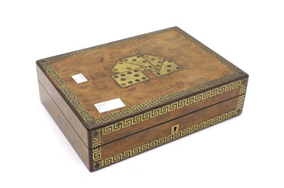 Lot 136 - A Victorian walnut games box