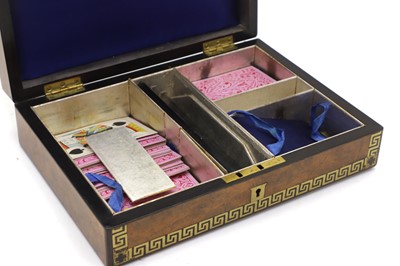 Lot 136 - A Victorian walnut games box