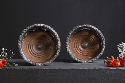 Lot 441 - A pair of George IV silver coasters