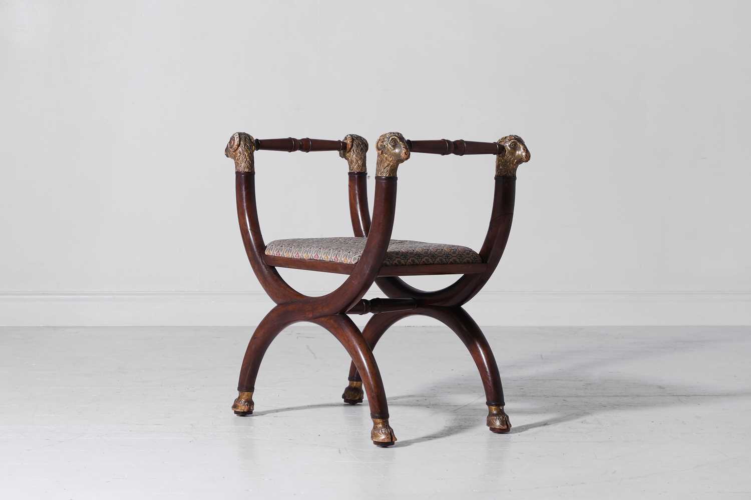 Lot 305 - A Regency-style mahogany 'X'-framed stool