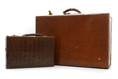 Lot 165 - A crocodile skin suitcase