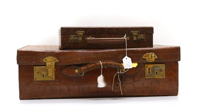Lot 165 - A crocodile skin suitcase